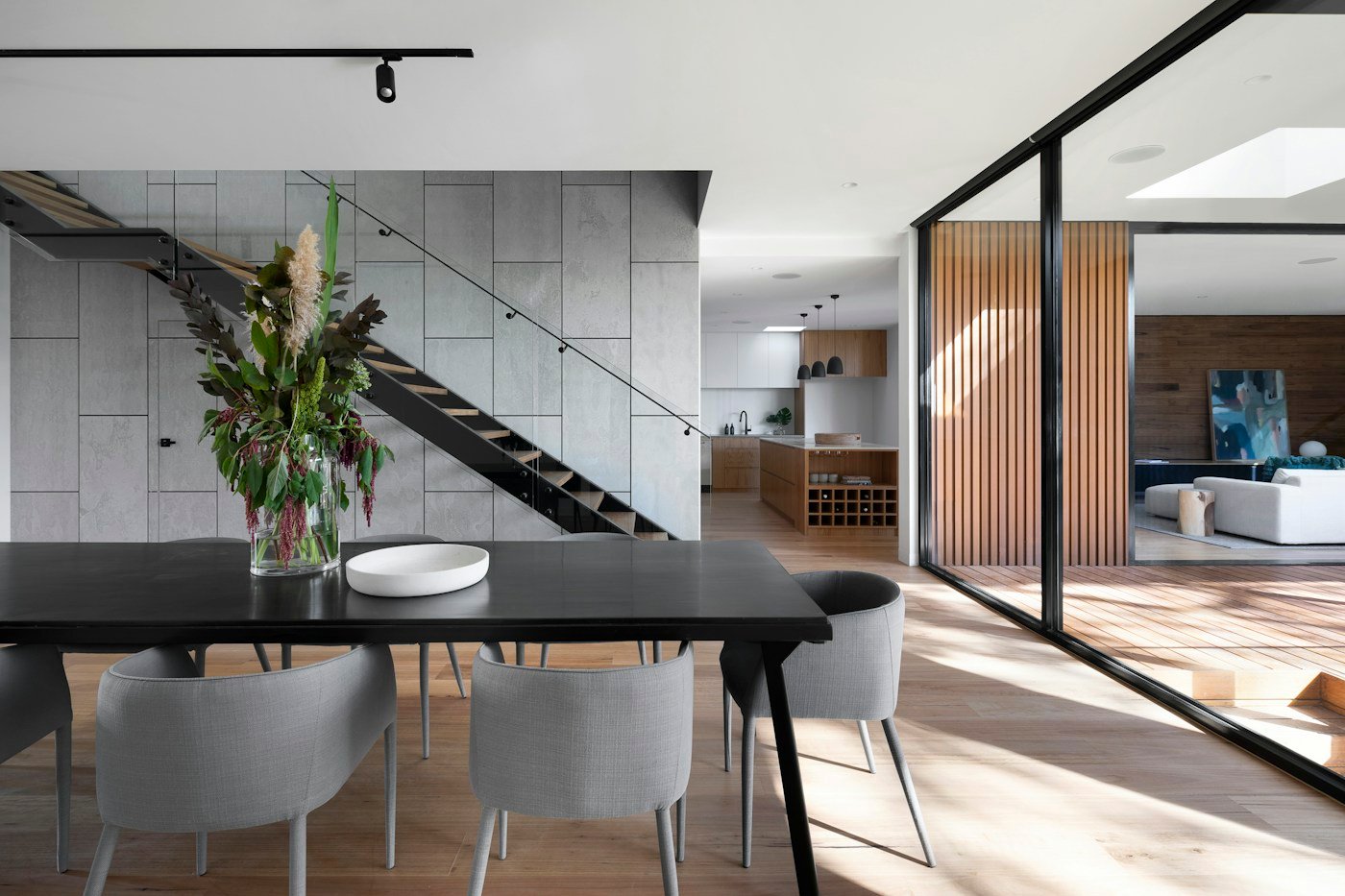 Warm, light-filled interior with natural textures and tailored architectural details
